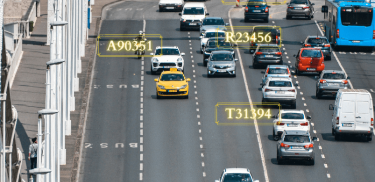 Cars running on a road along with numbers highlighted